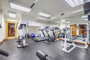 A gym with treadmills, elliptical machines, and weightlifting equipment. - Free SkyCard Activities - Gas Fireplace, Parking, Equipped Kitchen, Fitness Ctr (Breckenridge)
