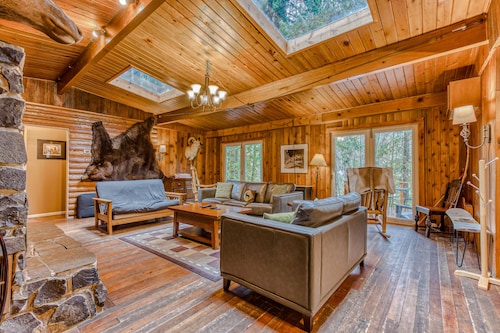 Rustic lodge with private hot tub, fireplace & riverfront views  - dog-friendly