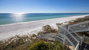 A beach with white sand and clear blue water. There is a white staircase leading down to the beach. - Gulf front! Pet Friendly! Beach House 30A Unit #2 - Gulf Front, Dune Allen Beach (Santa Rosa Beach)