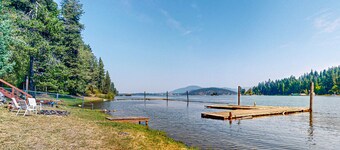 Grand waterfront home w/ decks offering lake views plus boat slip & nearby dock