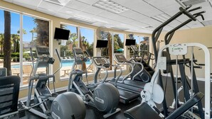 A gym with treadmills, elliptical machines, and weight equipment. - SHORT WALK TO BEACH!! PRIVATE POOL! (Destin)