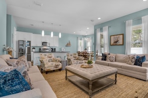 Relax in comfort with a plush sofa set and dining area, perfect for meals and leisure activities.