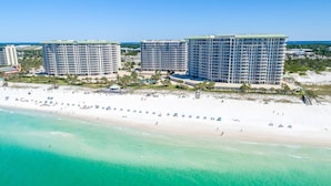 A beachfront hotel with multiple high-rise buildings, a sandy beach, and clear turquoise waters. - Updated, modern, beachfront condo w/private balcony! 🌴 (Destin)