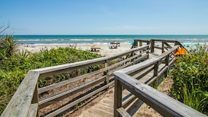 A wooden boardwalk leading to a beach with umbrellas and beach chairs. - 3 NIGHT MINIMUM SUMMER SPECIAL!!! GREAT FOR GUEST WHO CAN'T STAY A WEEK!!! (Pine Knoll Shores)
