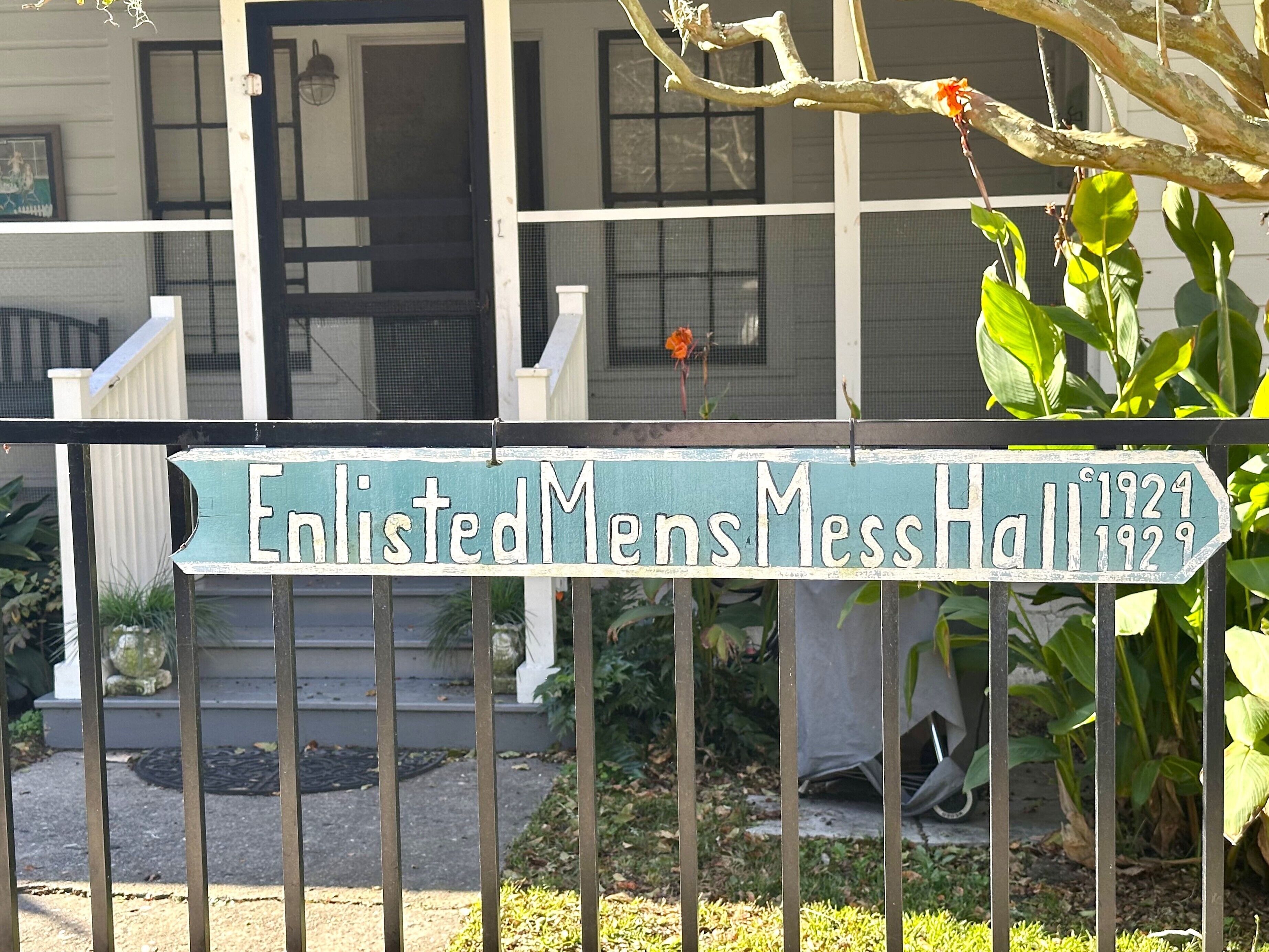 A sign for Enlisted Men's Mess Hall with the years 1924 and 1929.