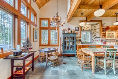 Riverfront home close to skiing & fishing with beach access & huge VHS library