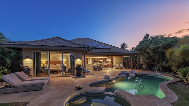 A modern house with a swimming pool, outdoor seating, and a well-lit patio area. - KaMilo 321 - Beautiful 3 bedroom with private pool! (Kamuela)