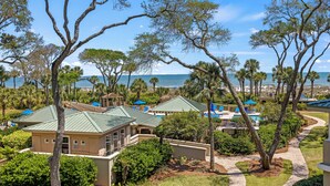 A resort with multiple buildings, a pool area, and a view of the ocean. - 3 bedroom/3 bathroom Oceanfront Villa with Amazing Condo Complex Amenities (Hilton Head Island)