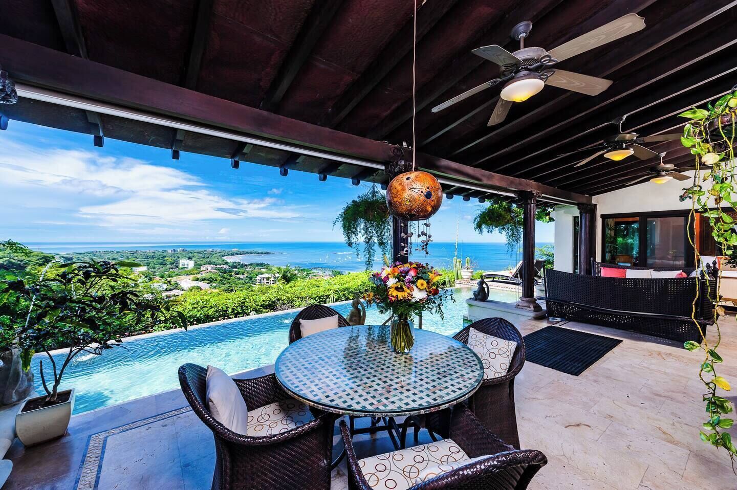 Stunning open terrace in Tamarindo, seamlessly connecting indoor and outdoor spaces. Perfect for relaxing, enjoying ocean breezes, and taking in breathtaking beach views at this vacation rental.