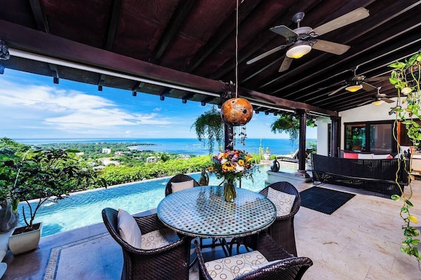 Stunning open terrace in Tamarindo, seamlessly connecting indoor and outdoor spaces. Perfect for relaxing, enjoying ocean breezes, and taking in breathtaking beach views at this vacation rental.