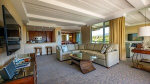 A modern hotel room with a living area, kitchen, and balcony. - Whaler 523 - Amazing Oceanfront on Kaanapali Beach (Lahaina)