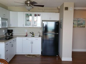 Fridge, microwave, stovetop, coffee/tea maker