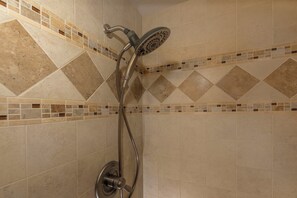 A shower with a handheld showerhead and a wall-mounted control. - Maui Vista #2-423 Close to Kamaole Beach and Pickleball Courts! Pool, Wifi (Kihei)