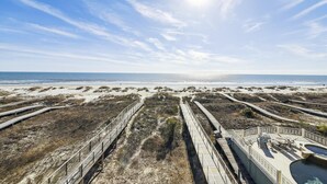 A beach with wooden boardwalks and a pool area. - 2 Collier, Oceanfront, Dogs OK, Pool, Free Golf, Elevator (Hilton Head)