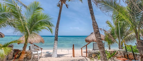 On the beach, sun-loungers