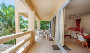 Outdoor dining - Spacious and serene, beachfront condo with AC, WiFi, onsite restaurant, pool! (Akumal)