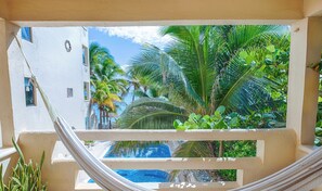 Private Balcony Overlooking the Pool - Spacious and serene, beachfront condo with AC, WiFi, onsite restaurant, pool! (Akumal)