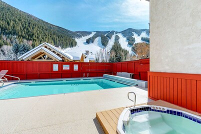 Ski-in/ski-out alpine condo with hot tub, sauna, seasonal pool & views