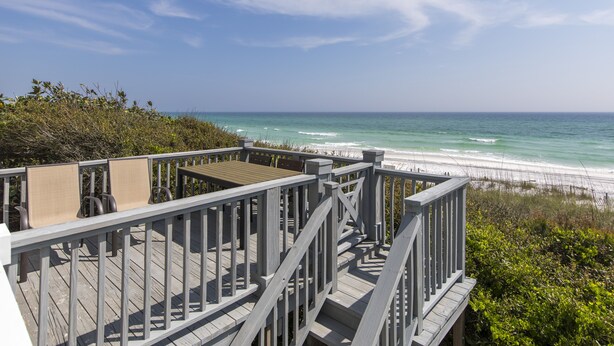 A wooden deck with chairs overlooking a beach. - Fabulous Gulf Front Home, Gated neighborhood, Double porches, Santa Rosa Beach (Santa Rosa Beach)