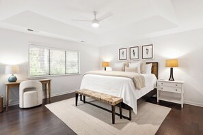 A bedroom with a bed, bedside tables, a bench, a desk, and a chair. - 22 Hollyberry:  A BESTNEST by Beverly Serral (Hilton Head Island)