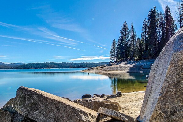 Surrounded by dense forest and serene waters, this lakeside setting offers a tranquil escape.