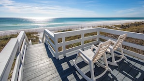 A wooden deck with white railings overlooking a beach. - GULF FRONT! Pet Friendly! Beach Cottage 30A- Dune Allen Beach (Santa Rosa Beach)