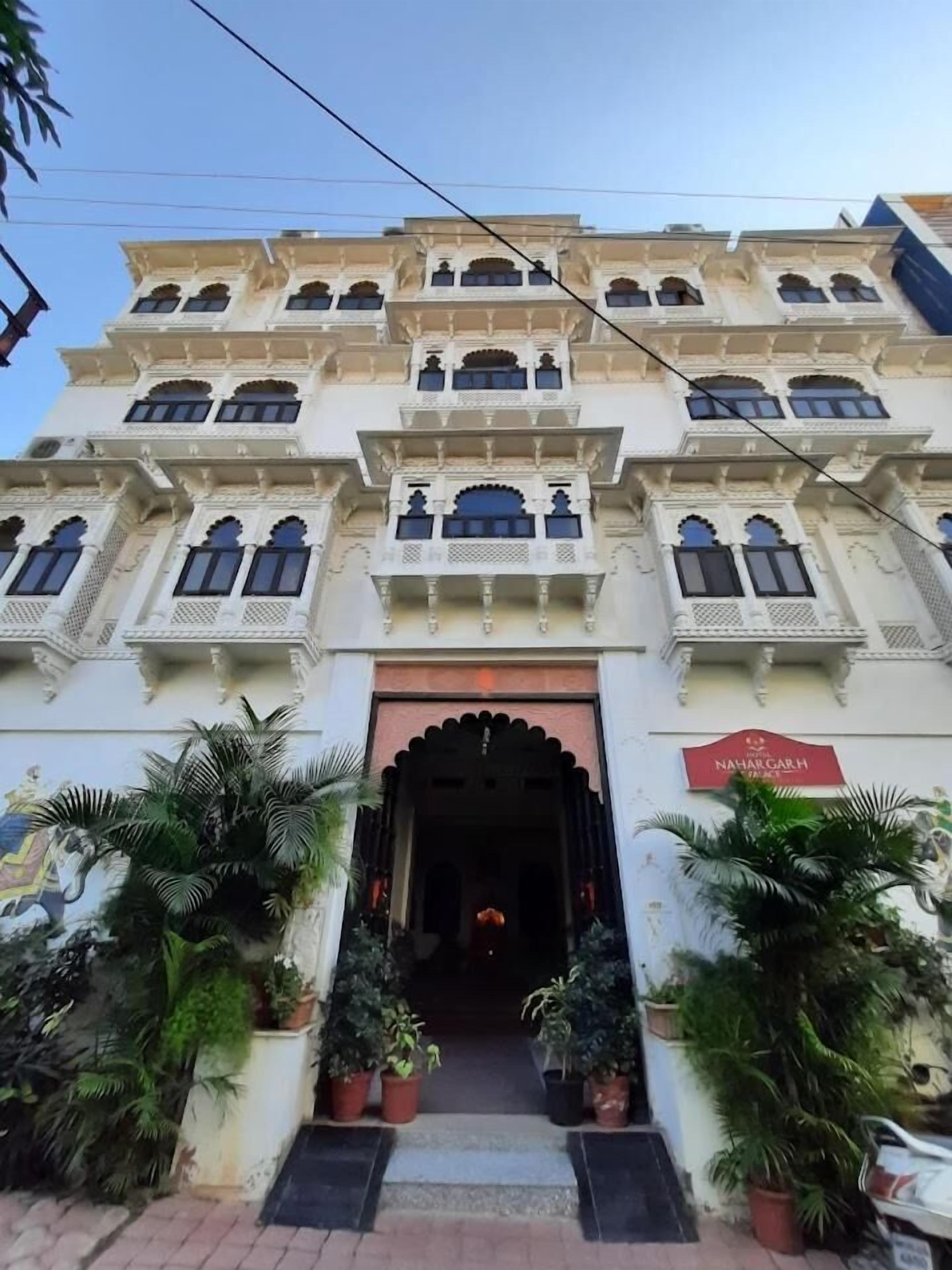 A multi-story building with a traditional architectural style, featuring arched windows and decorative elements.