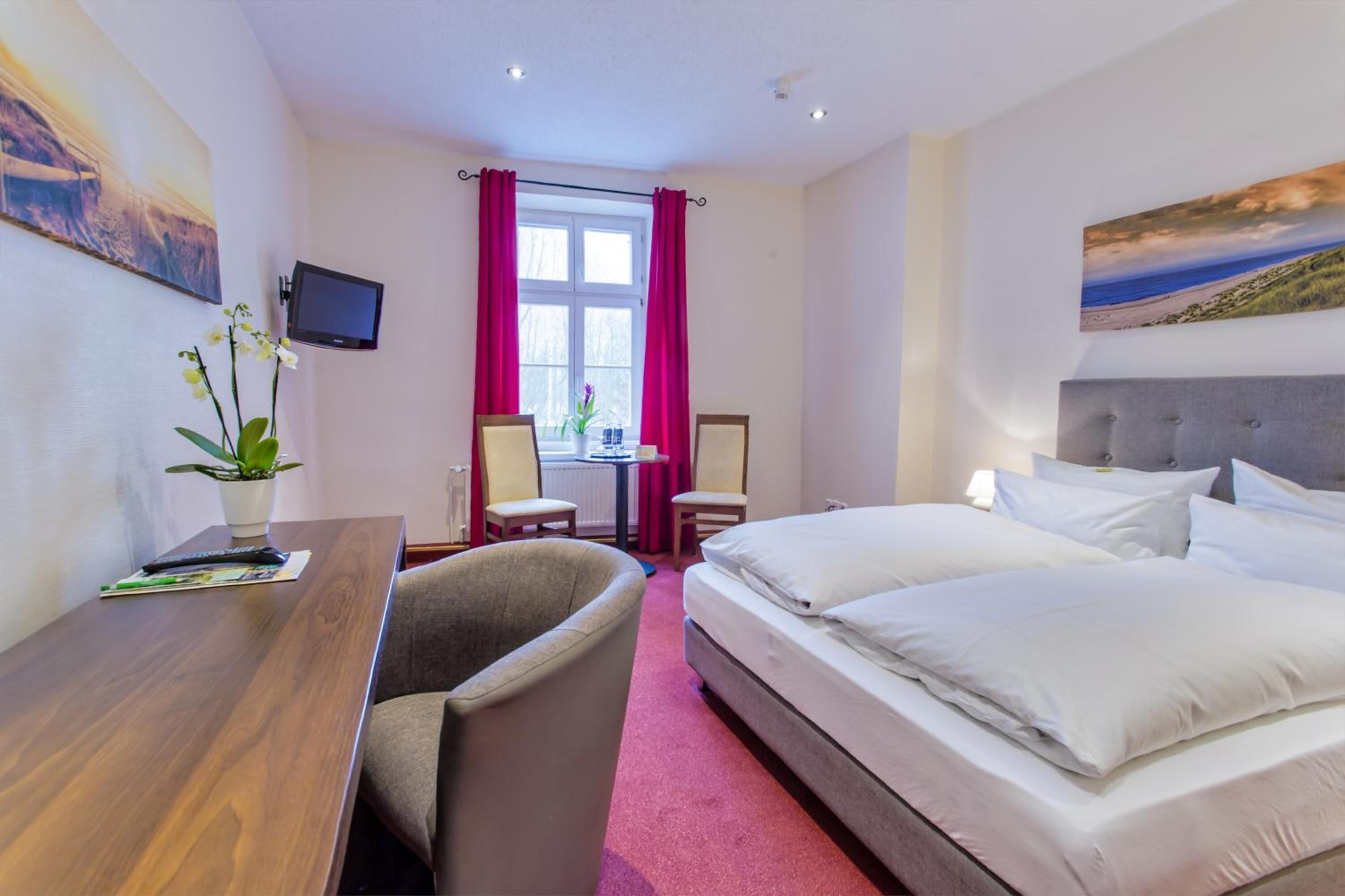 premium bedding, desk, blackout curtains, iron/ironing board