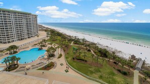 A resort with a large pool, beach access, and a view of the ocean. - WELL APPOINTED & ELEGANT CONDO! GULF FRONT WITH SWEEPING VIEW (Destin)