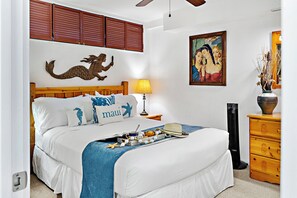 Step into your bright, inviting bedroom with crisp white linens and island-inspired touches. Your cozy bed awaits, complete with thoughtful details to make you feel at home.