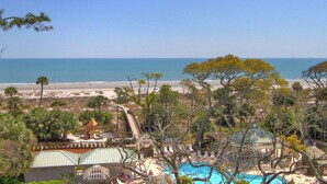 A resort with a pool, beach view, and a small building with a green roof. - 4506 Windsor Court - 5th Floor - Serenity at its best.  AMAZING VIEWS! (Hilton Head Island)