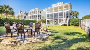 A large, multi-story house with a covered porch and a pool. - Family Fun Beach House! Ocean Views, Private Pool, Fire Pit, Video Games, Pool Table, Elevator! (Isle of Palms)