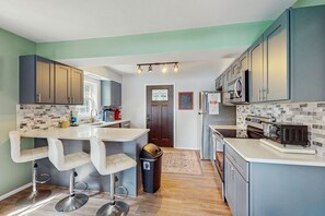 Fridge, microwave, oven, stovetop - Lakefront Cabin with Private Dock, Hot Tub, & Game Room - Dogs Okay (Swanton)