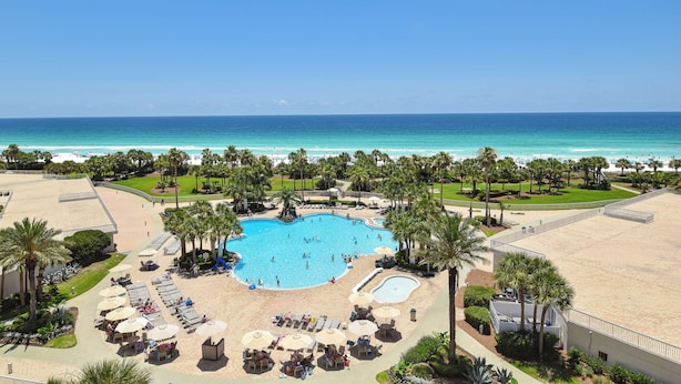 A resort with a large swimming pool, beach area, and ocean view. - Charming, bright beachfront condo w/private balcony! 🌴 (Destin)