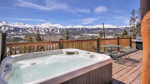 A hot tub on a wooden deck with a mountain view. - Free SkyCard Activities - Ski Area Views, Private Hot Tub - Barton Cabin (Breckenridge)