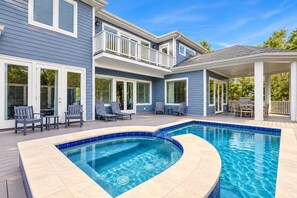A residential property with a swimming pool, outdoor seating, and a covered patio area. - 52 N. Forest Beach-4th row (176 yard walk) to ocean w/ elevator & much more! (Hilton Head Island)