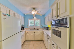 Fridge, stovetop, dishwasher, coffee/tea maker