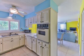 Fridge, stovetop, dishwasher, coffee/tea maker