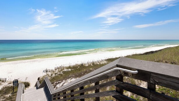 A wooden staircase leading to a beach with clear turquoise water and a sandy shore. - Seagrove Beach Home + Carriage House + Bikes (Santa Rosa Beach)