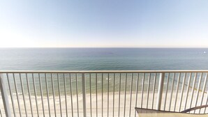 A balcony with a view of the ocean.