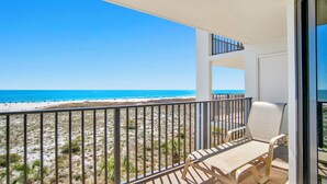 A balcony with a view of a beach and ocean. - Beautifully Updated Phoenix VI 2BR 4th Floor Condo!! (Orange Beach)