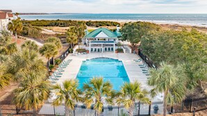 A resort with a swimming pool, beachfront view, and a large building with a green roof. - Stunning Ocean Views, Just steps to the Pool! 32 Ocean Pt (Isle of Palms)