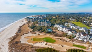 A coastal resort with beachfront properties, a golf course, and a large body of water. - Stunning Ocean Views, Just steps to the Pool! 32 Ocean Pt (Isle of Palms)