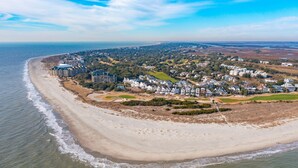 An aerial view of a coastal area with a beach, residential buildings, and a golf course. - Stunning Ocean Views, Just steps to the Pool! 32 Ocean Pt (Isle of Palms)