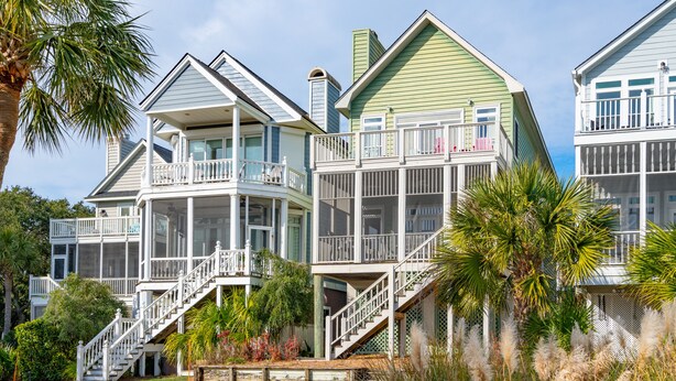 A large, multi-story house with multiple balconies and a covered porch area. - Stunning Ocean Views, Just steps to the Pool! 32 Ocean Pt (Isle of Palms)