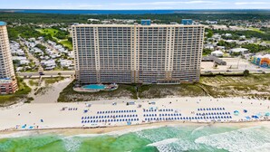 A high-rise hotel with a pool and beach access. - BEACHFRONT UNIT!! COMFORTABLY SLEEPS 8! UPDATED JUNE 2026!! (Panama City Beach)