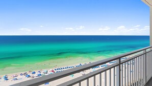 A balcony with a view of a beach, clear turquoise water, and a clear sky. - BEACHFRONT UNIT!! COMFORTABLY SLEEPS 8! UPDATED JUNE 2026!! (Panama City Beach)