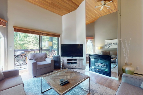 Gather around the gas fireplace in this inviting and open-concept living room.