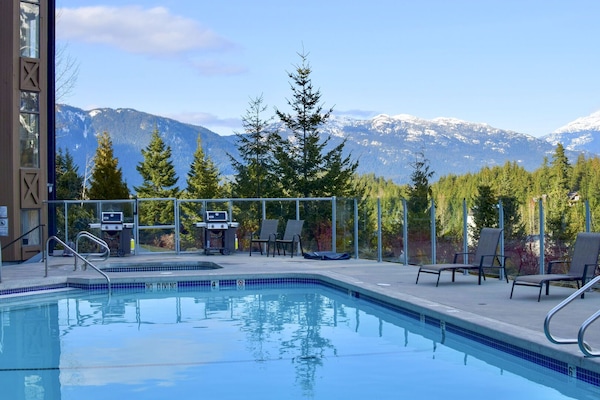 Soak in the rooftop hot tub or take a refreshing dip in the pool with mountain views.