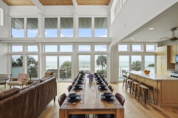 Enjoy meals in this elegantly designed dining area with ocean views and a comfortable seating area.
